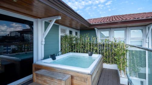 a hot tub on the balcony of a house at Loop Hotel Bosphorus İstanbul in Istanbul