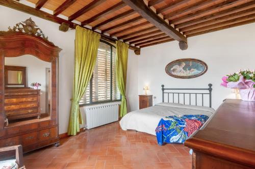 a bedroom with a bed and a dresser and a window at Universal Harmony - Usignolo in Dicomano