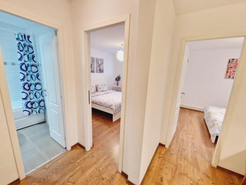 a bedroom with a bed and a mirror at DREAM Apartment in Sinaia