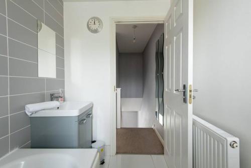 a white bathroom with a toilet and a sink at Spenny View in Spennymoor