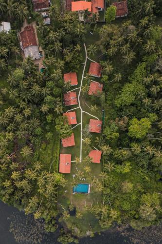 an aerial view of a yard with houses and trees at Simply Peace in Tangalle