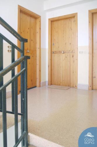 an empty room with two doors in a building at CASA SOFIA in Scalea
