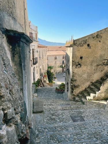 an alley in an old town with buildings at CASA SOFIA in Scalea