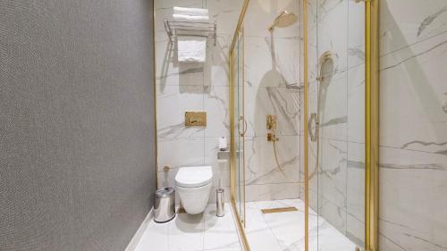 a bathroom with a shower and a toilet in it at Loop Hotel Bosphorus İstanbul in Istanbul