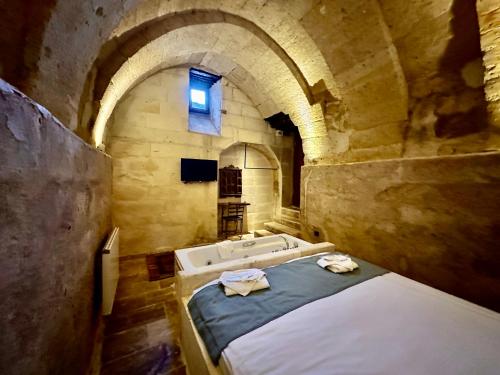 Katil atau katil-katil dalam bilik di Harkasos Cave Hotel