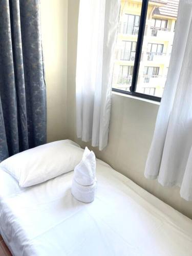 Postel nebo postele na pokoji v ubytování S&K One Oasis 2BR Condo Unit 2506