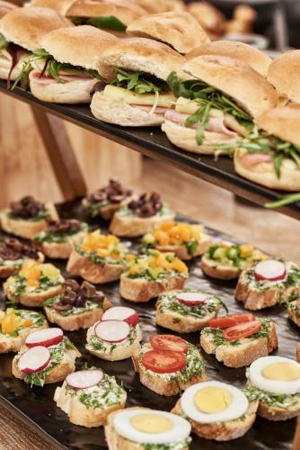 a display of sandwiches and other food items at Sea View Cityscape Hotel in Athens