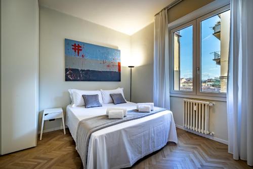 Katil atau katil-katil dalam bilik di YiD Cairoli design apartment