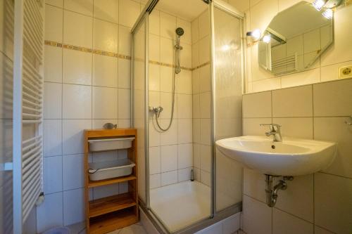 a bathroom with a sink and a shower at Felber in Büsum