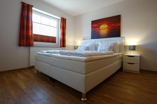Postel nebo postele na pokoji v ubytování Meereskönig Wohnung 1