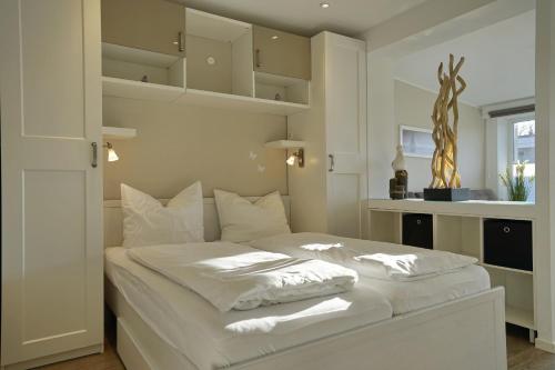 Кровать или кровати в номере Deichstern