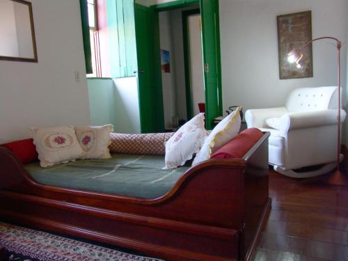 เตียงในห้องที่ Casa de João