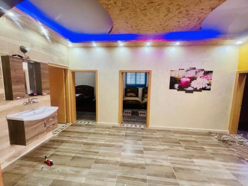 a large bathroom with a tub and a sink at Wadi rum village bed and breakfast in Wadi Rum