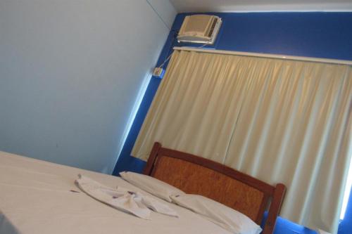 Ένα ή περισσότερα κρεβάτια σε δωμάτιο στο Hotel Cristal