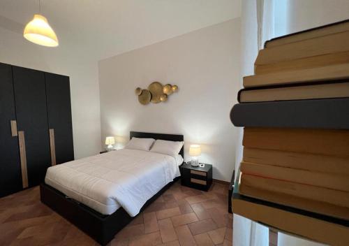 A bed or beds in a room at StarHome San Paolo