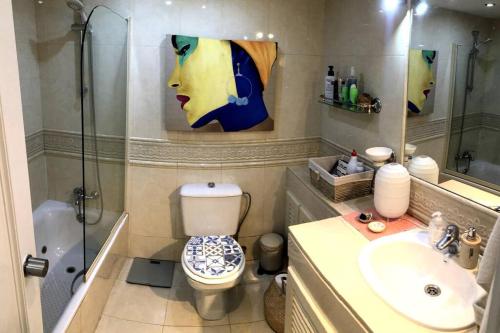 a bathroom with a shower and a toilet and a sink at Cozy House in La Manga Club in Atamaría