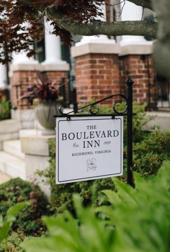 a sign that reads the boulevard inn in front of a building at The Boulevard Inn in Richmond