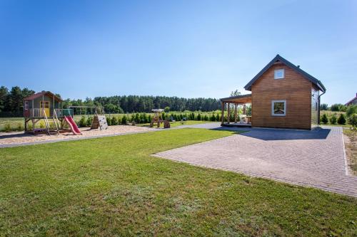 Foto dalla galleria di Zajęcza Chatka - Jeziora, Las , Łódka, Rower a Sitno