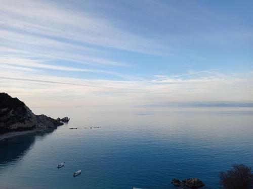 a large body of water with boats in it at Ostria in Agios Nikitas