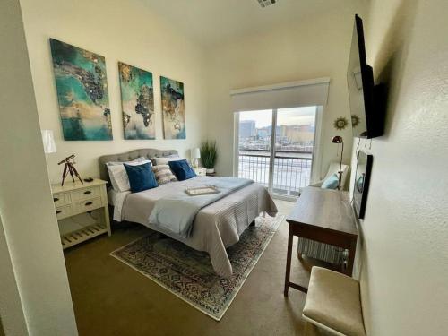 a bedroom with a large bed and a window at A Perfect Getaway in the Heart of the Action in Las Vegas