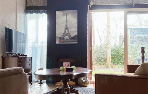 a living room with a coffee table and the eiffel tower at 2 Bedroom Gorgeous Home In Rheezerveen in Rheezerveen