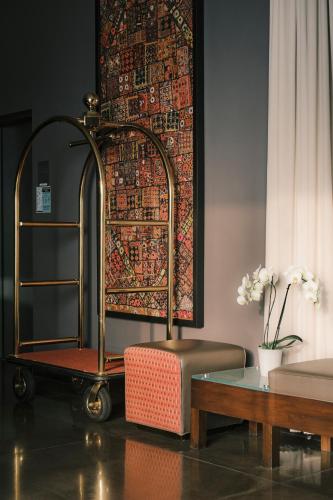 a living room with a couch and a table at SIRTAJ – Beverly Hills in Los Angeles