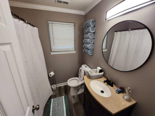 a bathroom with a sink and a mirror at s2. Lakeside house in Scottsboro in Scottsboro