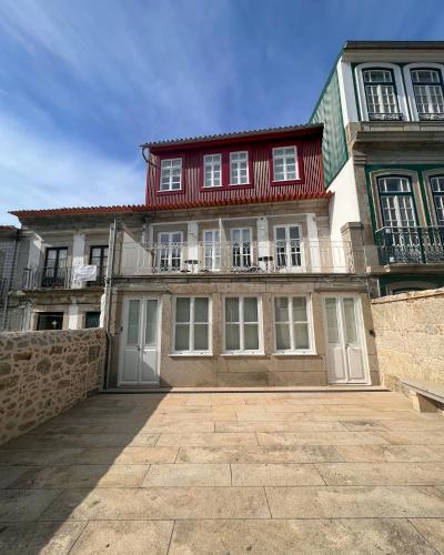 a large house with a red roof at Pátio 29 - Guest House in Viana do Castelo