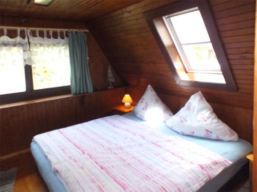 Postel nebo postele na pokoji v ubytování Ferienhaus Zum Gründel