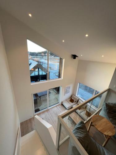an overhead view of a living room with a large window at Ferie bolig på Sørlandet in Kristiansand