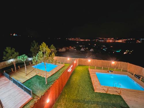 an aerial view of a swimming pool at night at Wonder of nature bungalov sapanca in Sapanca
