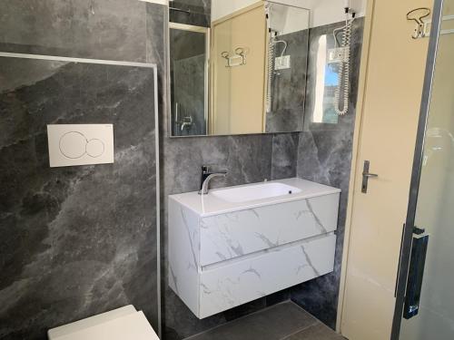 Koupelna v ubytování Hotel Helvetia