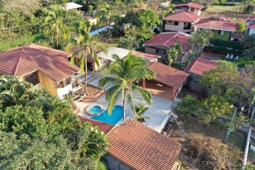 an aerial view of a house with a swimming pool at Uruka Lodge in Alajuela