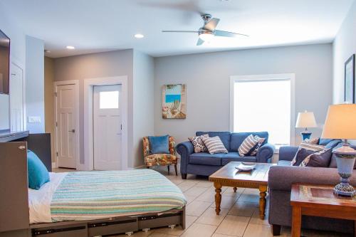 a living room with a couch and a table at Island Villa- Your Padre Island Escape in Padre Island