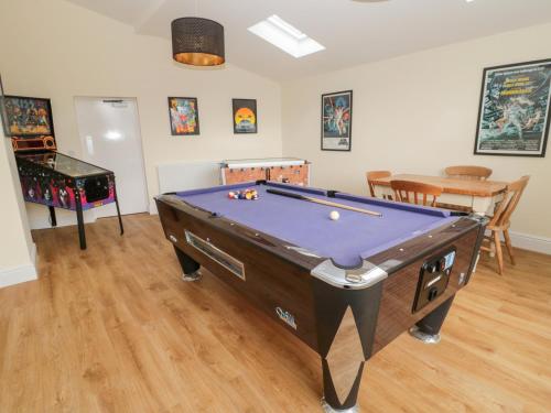 a living room with a pool table in a room at The Steadings in Morpeth