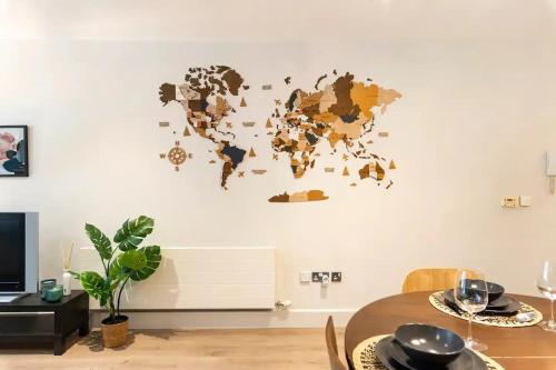 a world map on a wall in a living room at Cosy and modern apartment in the heart of Dublin in Dublin