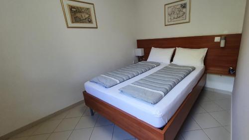 Postel nebo postele na pokoji v ubytování Apartment-Studio-Ginkgo-A1