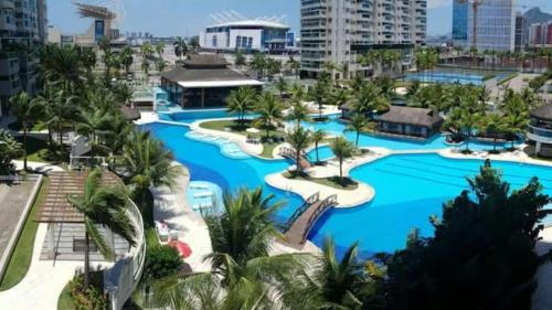 an aerial view of a resort with blue water at Apartamento Bora Bora Resort in Rio de Janeiro