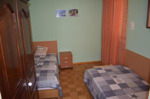 Ein Bett oder Betten in einem Zimmer der Unterkunft APARTMA SANDRA