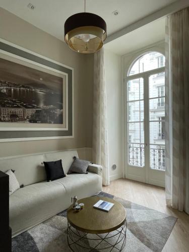 a living room with a couch and a table at Napoli Mariana Luxury in Naples
