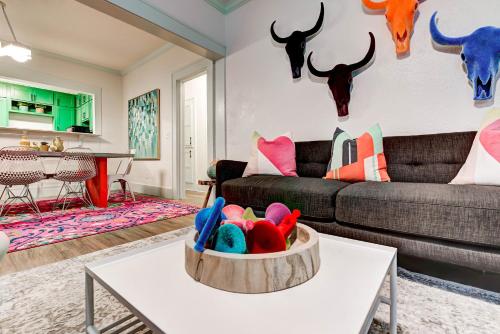 a living room with a couch and a table at Color Pop Cottage - Half mile from Plaza district in Oklahoma City