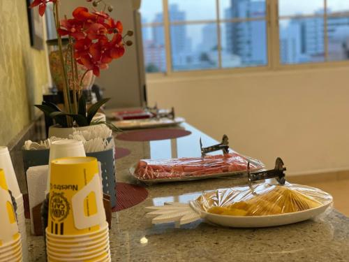 a counter with a plate of food on a table at Aparthotel Sevilla Suites in Panama City