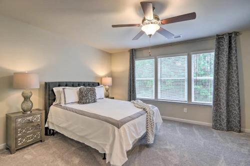 a bedroom with a bed and a ceiling fan at Modern 3BR Townhome 10 mins to Downtown ATL in Atlanta