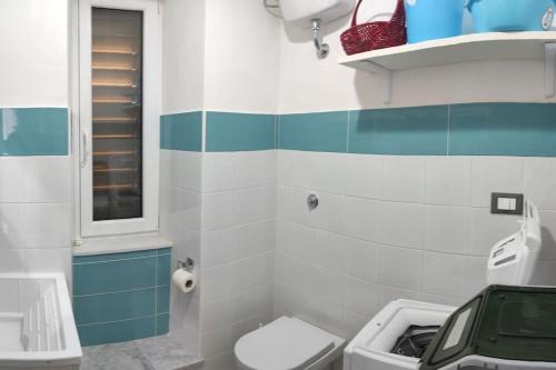 a bathroom with a toilet and a sink at Casa Alea - Appartamento turistico - Paola- in Paola