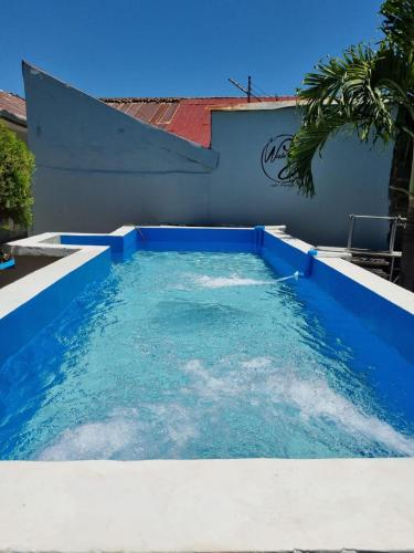 a pool of water in the side of a building at The Wabi Sabi in León