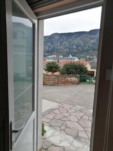 an open door to a patio with a view at Apartments Željka-Dobrota in Kotor