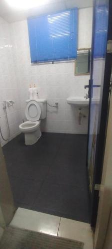 a bathroom with a toilet and a sink at CMK APARTMEN MUTIARA TOWER 3 BEDROOM KOTA BHARU#Netflix in Kota Bharu