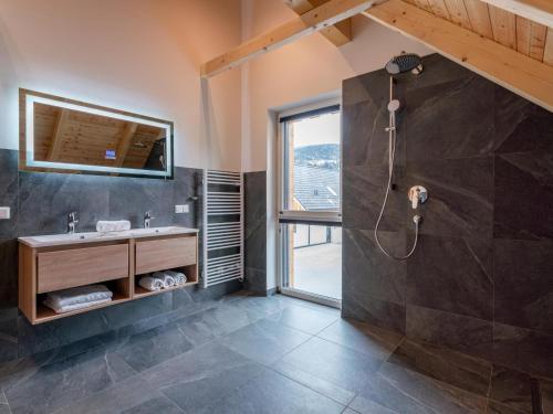 a bathroom with a shower and a sink at Mountain Chalet Arnica in Sankt Lorenzen ob Murau