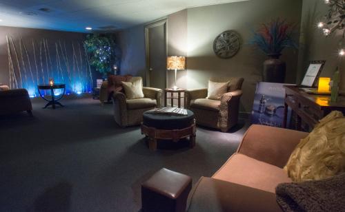 a living room with couches and chairs and a table at Hotel Murano in Tacoma