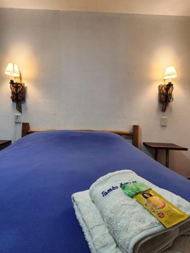 Una cama o camas en una habitación de Tambo Aymara